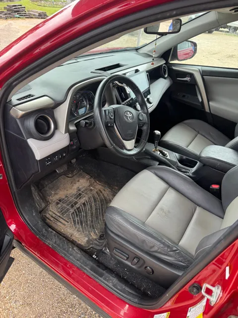 Toyota interior with dirt on the driver’s floor mat