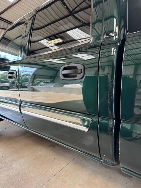 Close-up of vehicle paint and reflections