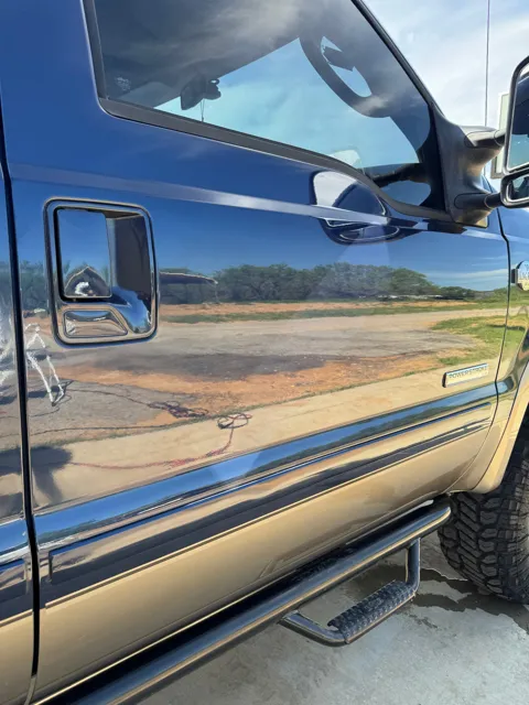 Close-up of vehicle paint and reflections