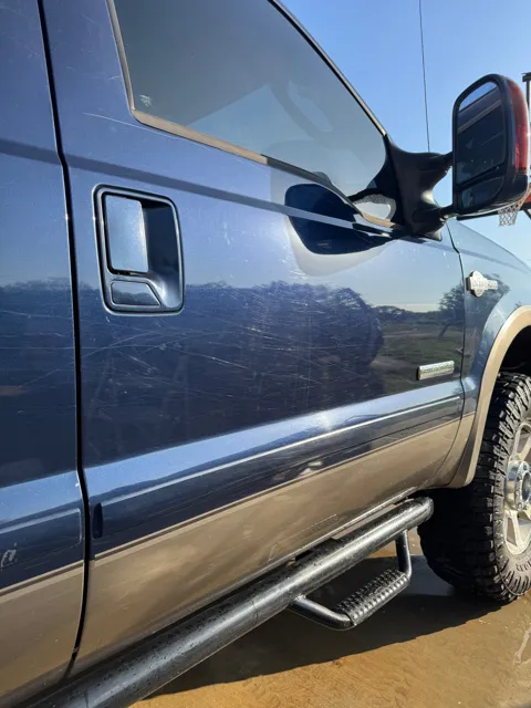 Close-up of vehicle paint and reflections