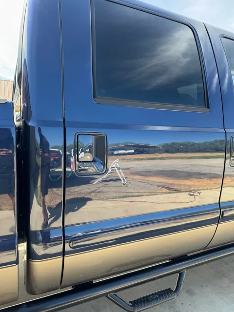 Close-up of vehicle paint and reflections