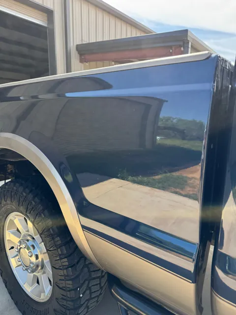 Close-up of vehicle paint and reflections
