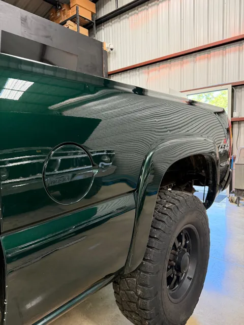 Close-up of vehicle paint and reflections