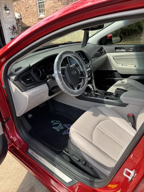 Vehicle cabin showing seats, dashboard and interior surfaces
