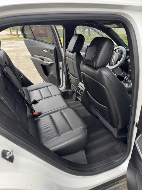 Vehicle cabin showing seats, dashboard and interior surfaces