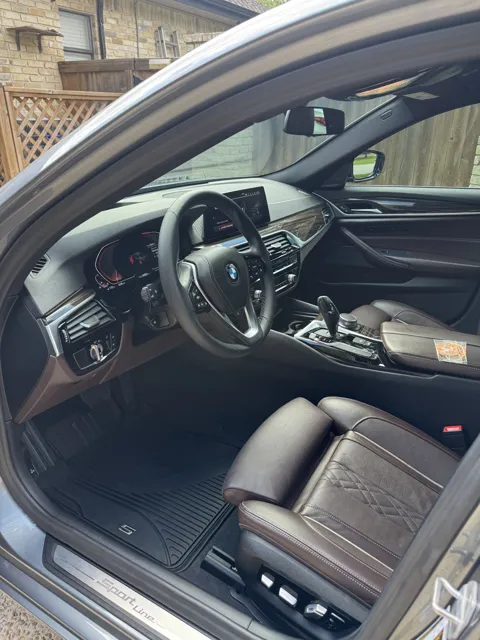 Vehicle cabin showing seats, dashboard and interior surfaces