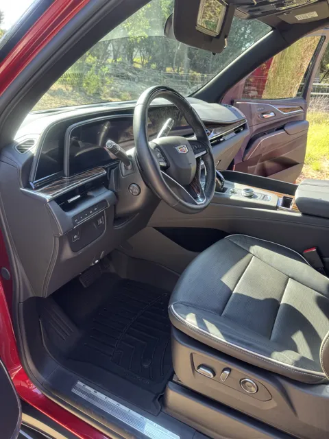 Vehicle cabin showing seats, dashboard and interior surfaces