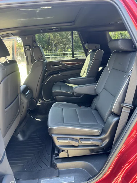 Vehicle cabin showing seats, dashboard and interior surfaces