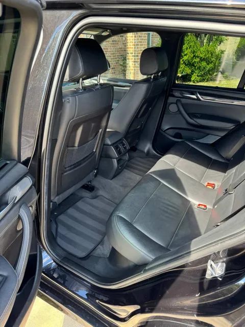Vehicle cabin showing seats, dashboard and interior surfaces