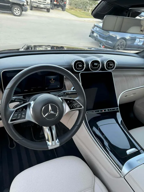 Vehicle cabin showing seats, dashboard and interior surfaces