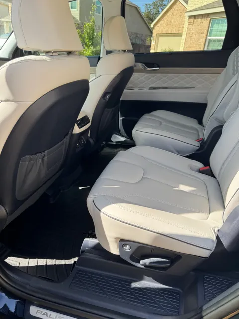 Vehicle cabin showing seats, dashboard and interior surfaces