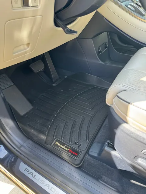 Vehicle cabin showing seats, dashboard and interior surfaces