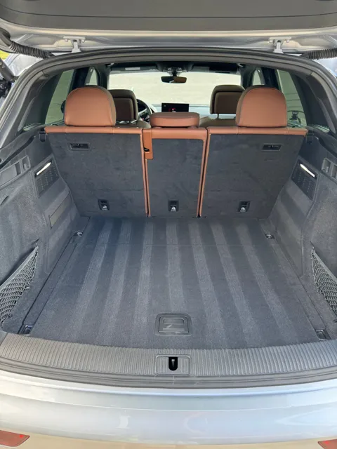 Vehicle cabin showing seats, dashboard and interior surfaces