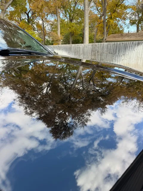 Close-up of vehicle paint and reflections