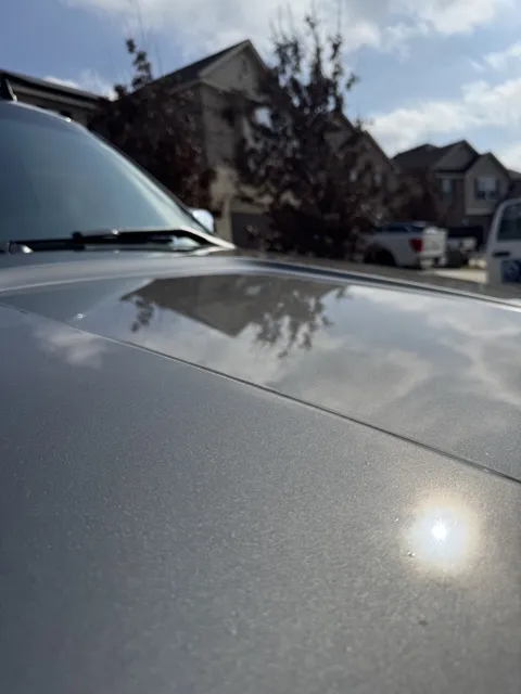 Close-up of vehicle paint and reflections