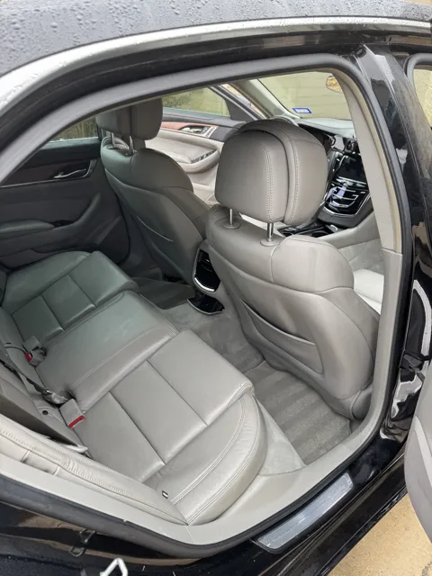 Vehicle cabin showing seats, dashboard and interior surfaces