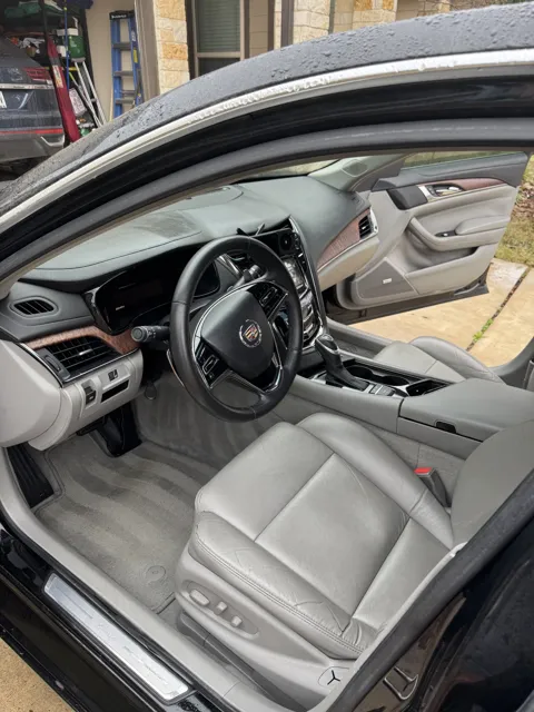 Vehicle cabin showing seats, dashboard and interior surfaces