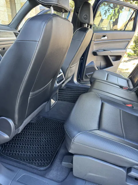 Vehicle cabin showing seats, dashboard and interior surfaces