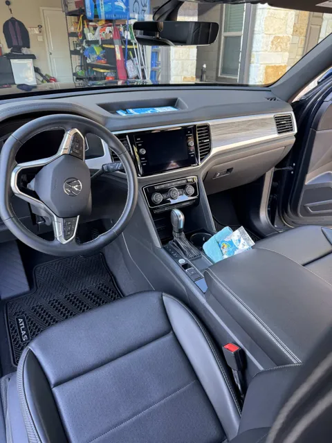 Vehicle cabin showing seats, dashboard and interior surfaces