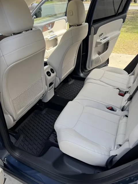 Vehicle cabin showing seats, dashboard and interior surfaces