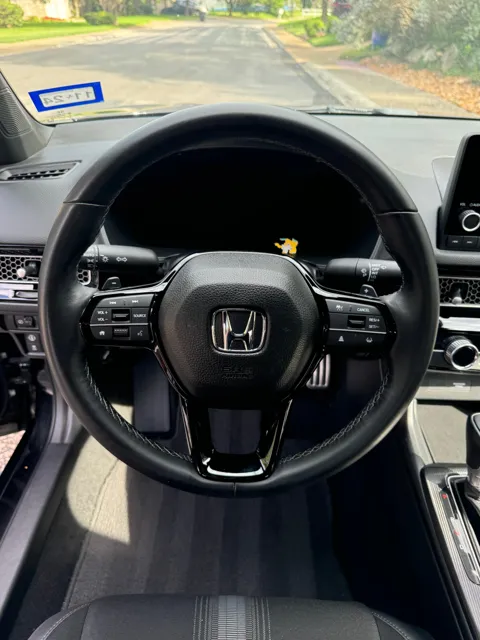 Vehicle cabin showing seats, dashboard and interior surfaces