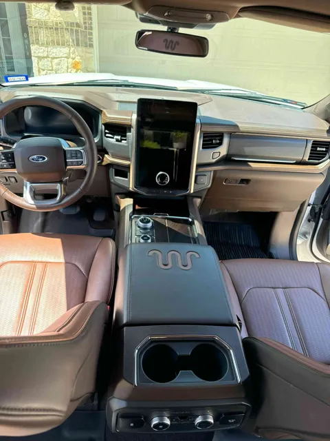 Vehicle cabin showing seats, dashboard and interior surfaces