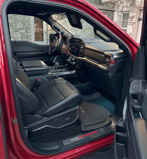 Vehicle cabin showing seats, dashboard and interior surfaces