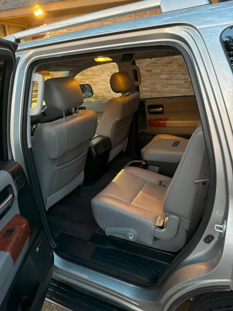 Vehicle cabin showing seats, dashboard and interior surfaces