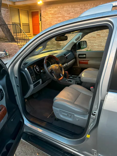 Vehicle cabin showing seats, dashboard and interior surfaces