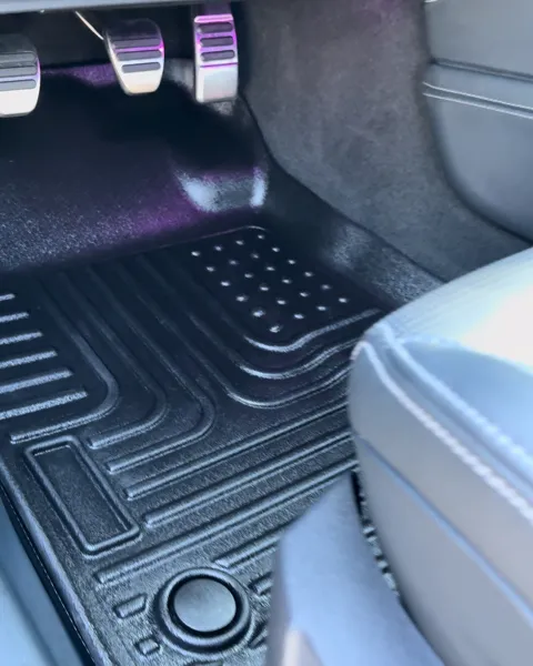 Vehicle cabin showing seats, dashboard and interior surfaces