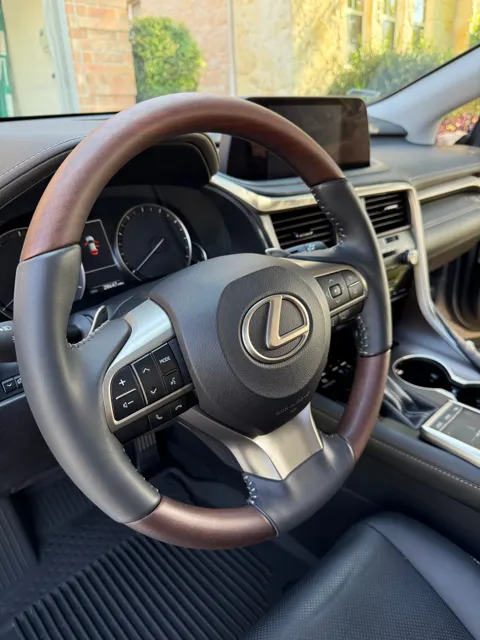 Vehicle cabin showing seats, dashboard and interior surfaces