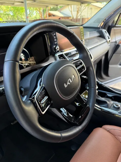 Vehicle cabin showing seats, dashboard and interior surfaces