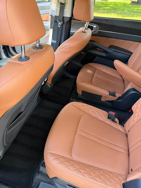 Vehicle cabin showing seats, dashboard and interior surfaces