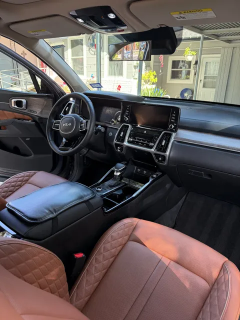 Vehicle cabin showing seats, dashboard and interior surfaces