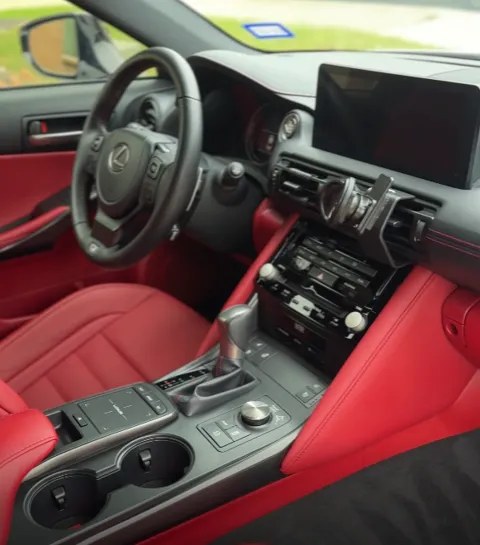 Vehicle cabin showing seats, dashboard and interior surfaces