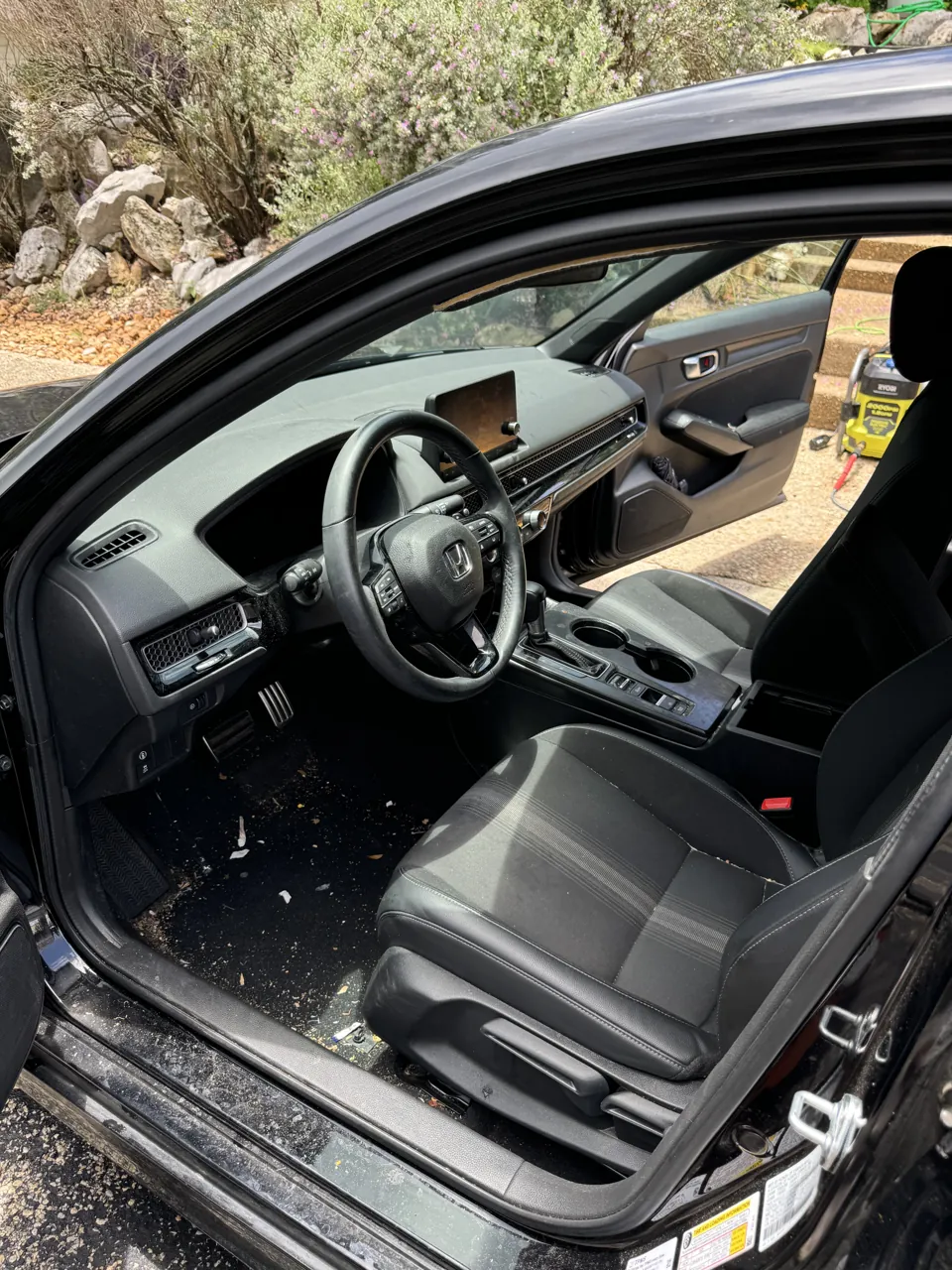 Honda Civic front seats and footwell before interior cleaning